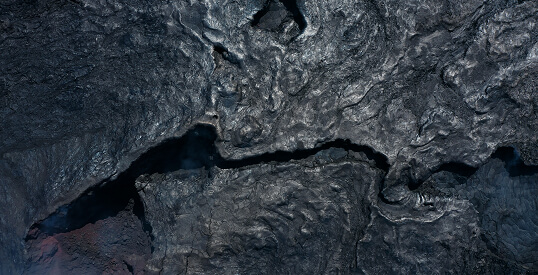 Chemistry Pinot Noir shaped rock surface close-up image.